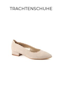 Ein beiger Damenschuh aus Wildleder mit niedrigem Blockabsatz und gezacktem Rand auf weißem Hintergrund. Das Wort "TRACHTENSCHUHE" erscheint über dem Schuh.