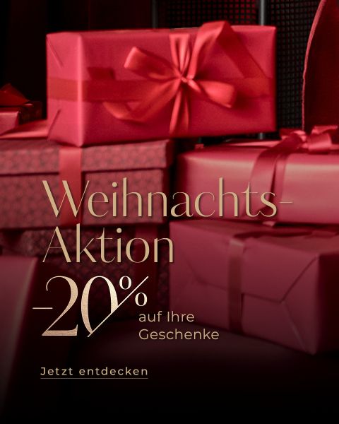 Rote Geschenkschachteln mit Bändern, die hinter einem goldenen deutschen Text gestapelt sind, der einen 20%igen Weihnachtsrabatt auf Geschenke anbietet. Auf der Schaltfläche steht "Jetzt entdecken.