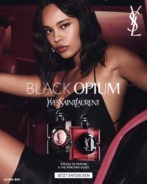 YSL Black Opium fragrance advertisement featuring a woman in a car with two perfume bottles and the Yves Saint Laurent logo in the corner; includes a 'Jetzt entdecken' callout and model name 'Alisha Boe'