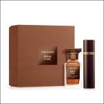 Tom Ford Ébène Fumé Parfüm-Set mit brauner Schachtel, Glasflakon und passendem Reisespray, alles mit goldenen Etikettenakzenten.