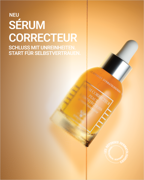 Eine Flasche Serum mit Tropfer vor orangefarbenem Hintergrund, mit einem deutschen Text über die Korrektur von Hautunregelmäßigkeiten und die Stärkung des Selbstbewusstseins.