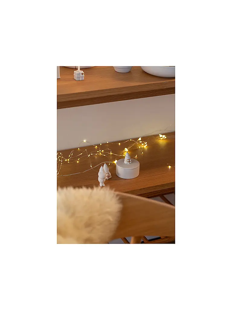 RAEDER | Weihnachts Porzellanfigur Santa  Packt Geschenke  | Weiss